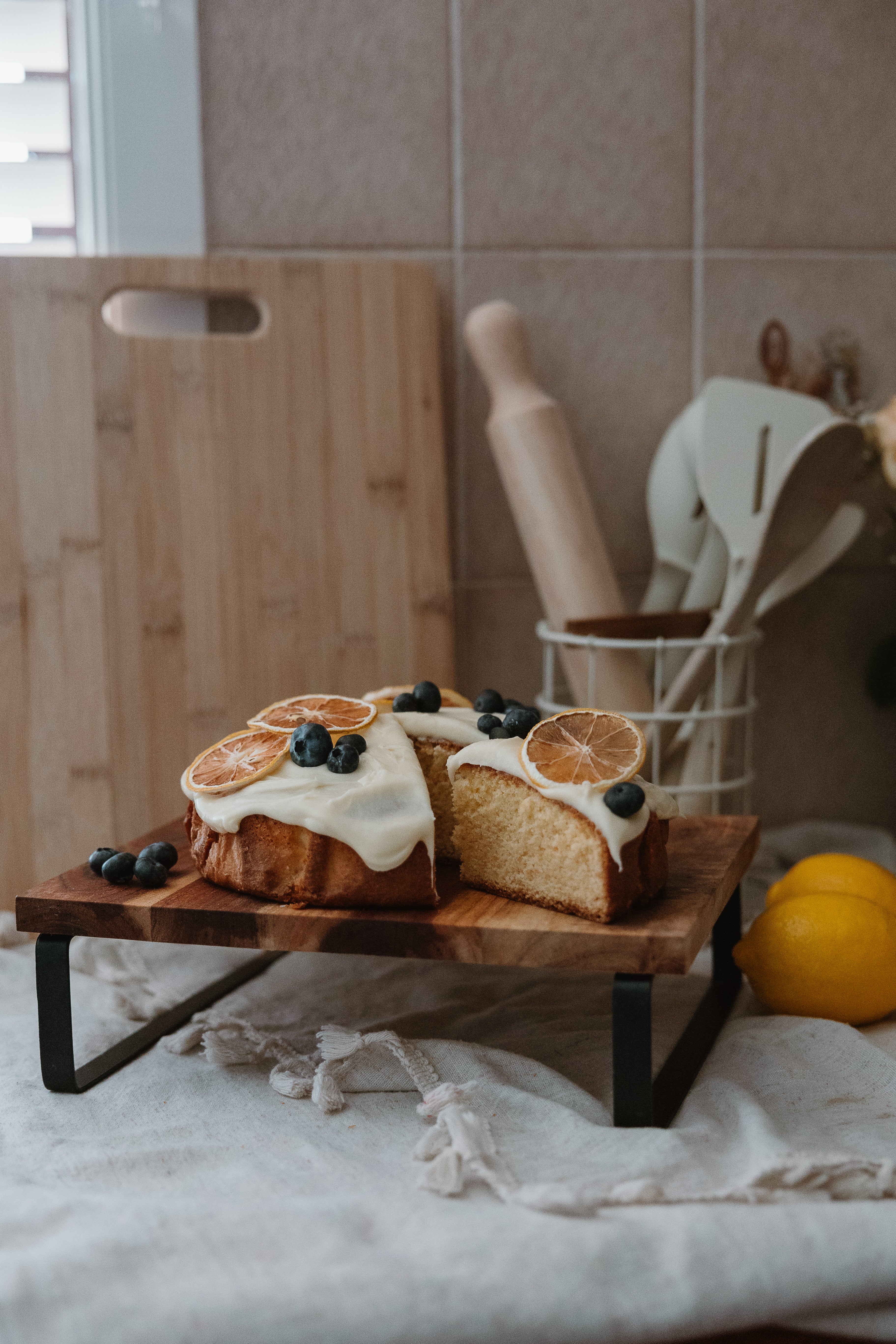 Premium dried citrus slices garnishing a frosted cake with blueberries, perfect for desserts and cocktails in Australiaslider_item_z3EUBQ