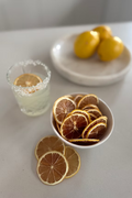Dried lime slices in an 80g Citrus Huis jar, showcasing vibrant green citrus pieces for culinary and beverage use.