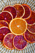 Jar of Citrus Huis dried orange mix, 80g, showing vibrant dried orange slices and pieces in a clear container.