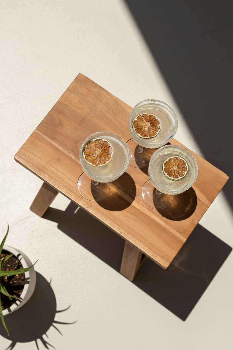 Premium dried citrus slices garnishing cocktails on wooden table, handcrafted in Australia for vibrant flavor